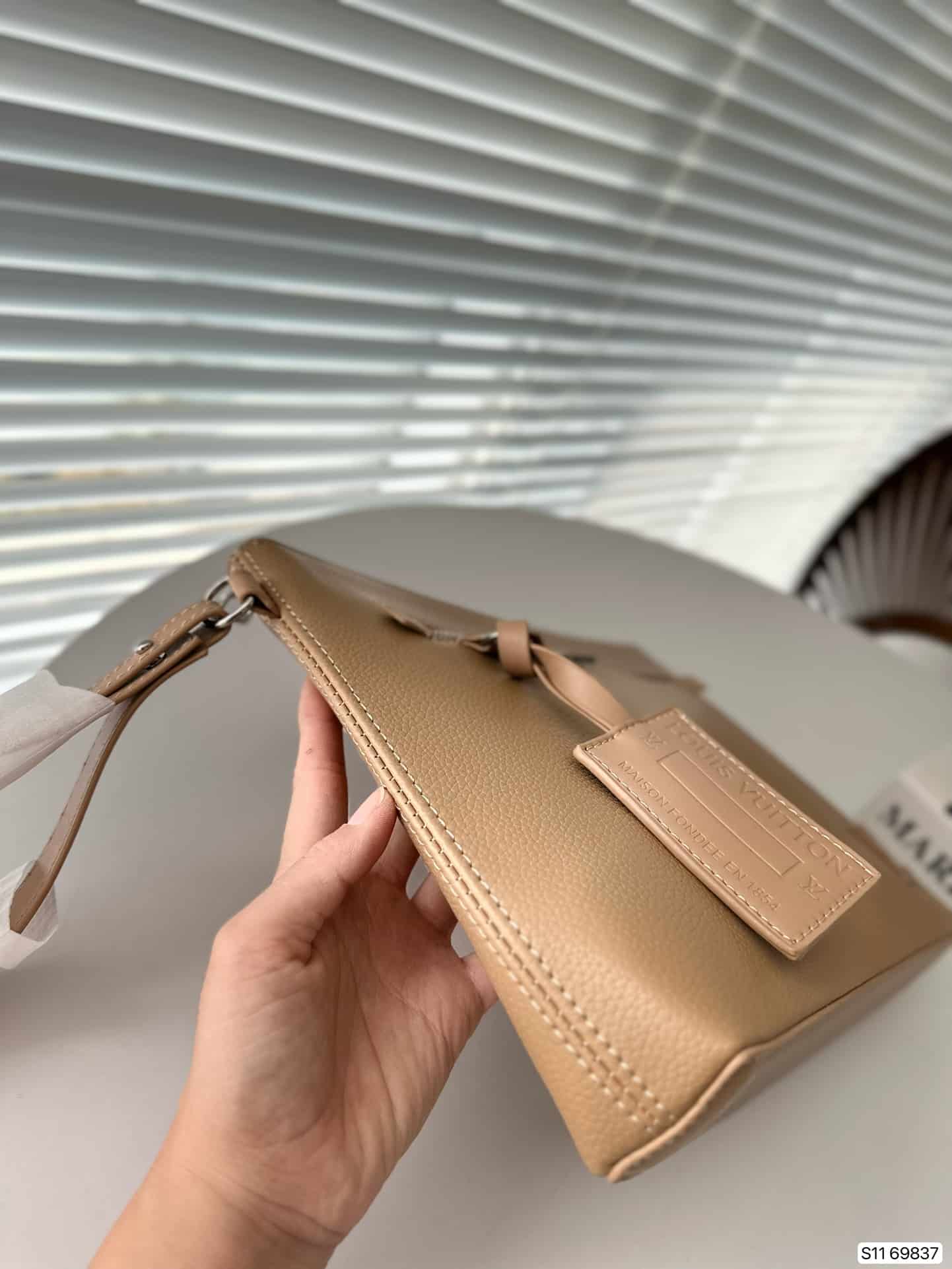 Louis Vuitton Takeoff Leather Pouch Beige 30Cm - Image 5