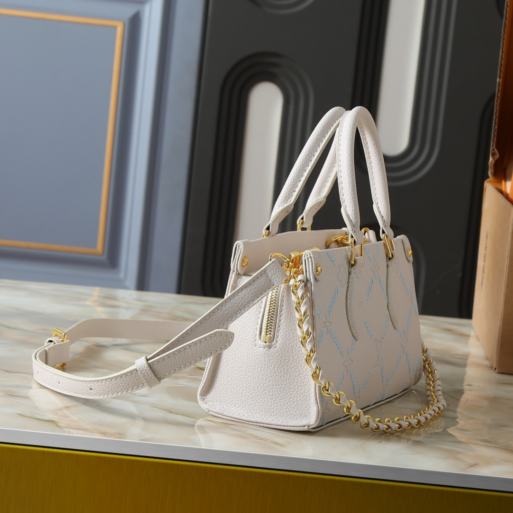 Louis Vuitton Onthego East West Monogram Empreint Couturee Handbag Ivory 25cm M29487 - Image 3