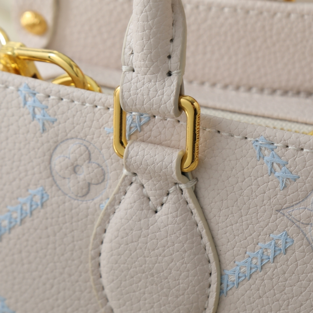 Louis Vuitton Onthego East West Monogram Empreint Couturee Handbag Ivory 25cm M29487 - Image 4
