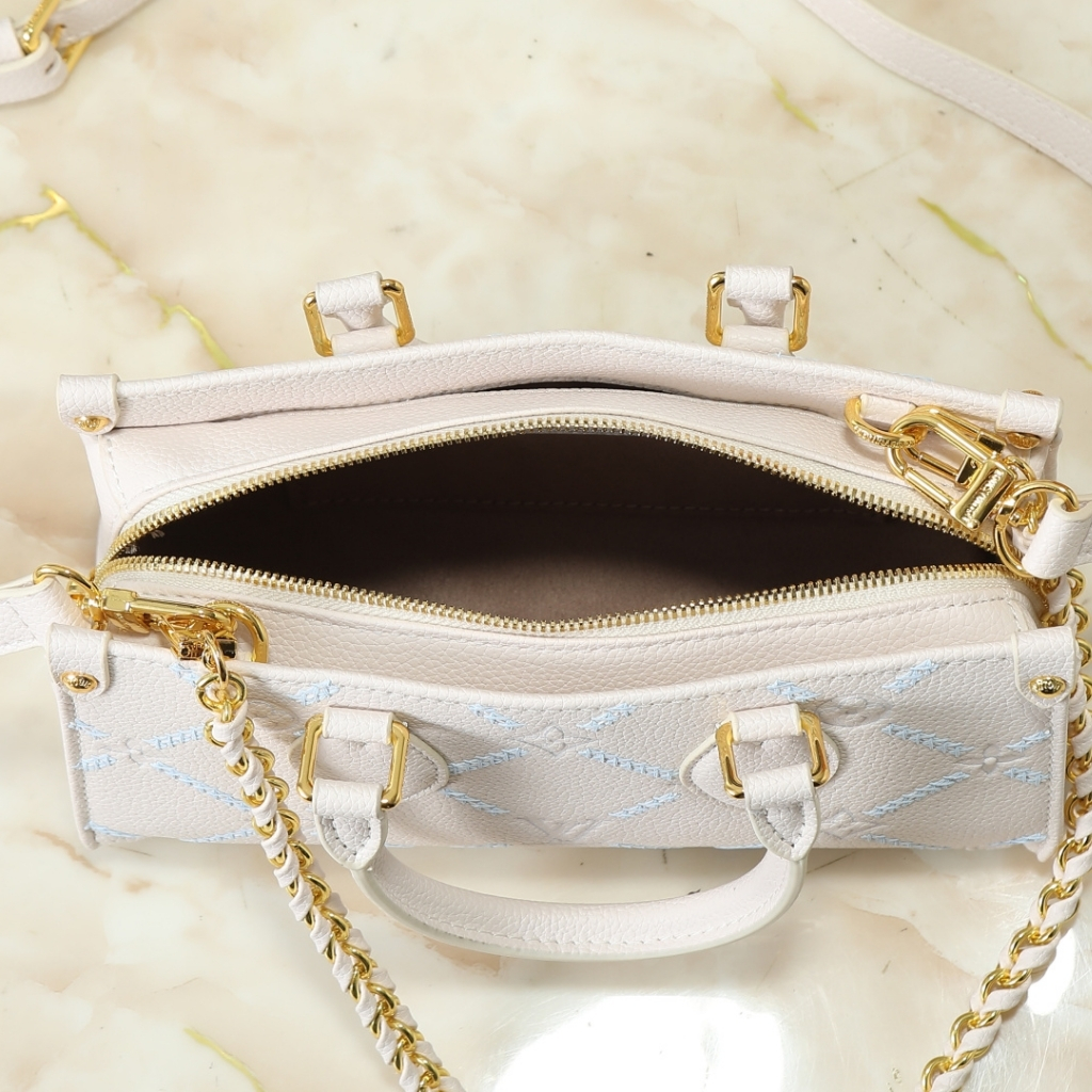 Louis Vuitton Onthego East West Monogram Empreint Couturee Handbag Ivory 25cm M29487 - Image 6